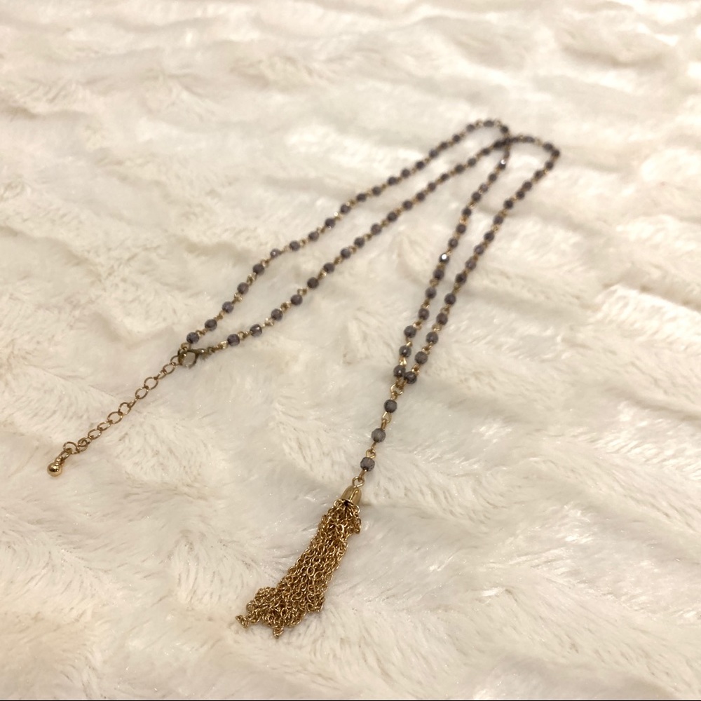 Long beaded necklace with gold tassel